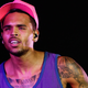Illustration for article titled Retail Vigilante Slapping This Man Beats Women Stickers on Chris Brown Albums